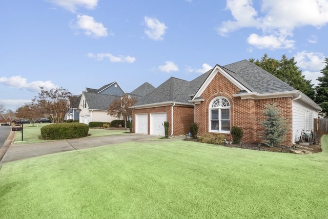 view of front of house with a garage and a front lawn