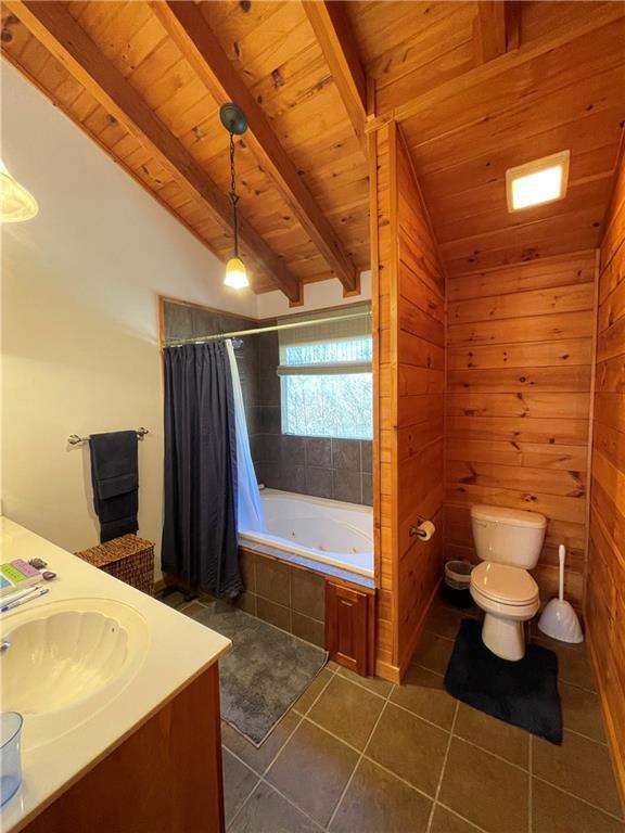 71 Hidden Valley Dr S, Ellijay, GA 30536 - bathroom featuring tile patterned flooring, wooden ceiling, vanity, a combined bath / shower with jetted tub, and wooden walls