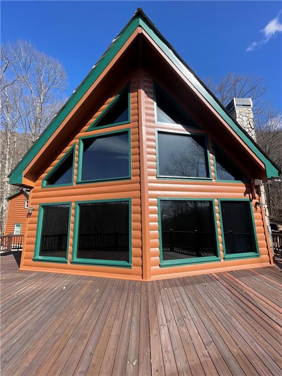 71 Hidden Valley Dr S, Ellijay, GA 30536 - view of property exterior featuring a deck and a chimney
