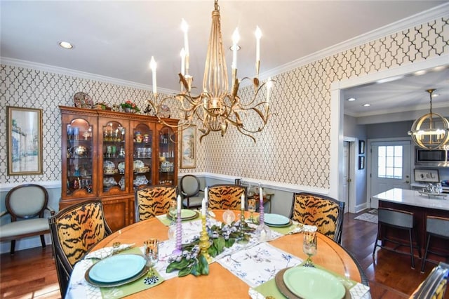 dining space featuring crown molding, dark hardwood / wood-style flooring, and a notable chandelier