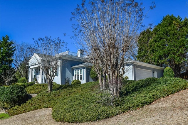 view of home's exterior with a garage