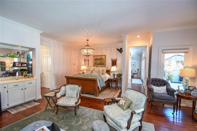 bedroom with an inviting chandelier, dark hardwood / wood-style floors, and ornamental molding