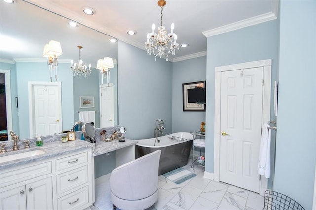 bathroom with a chandelier, a tub to relax in, vanity, and ornamental molding