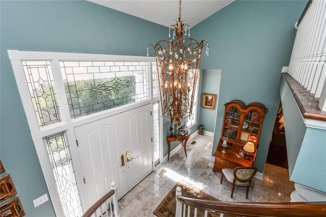 entrance foyer featuring a chandelier