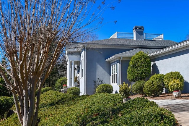 view of home's exterior featuring a balcony