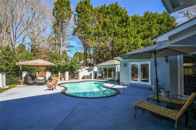 view of swimming pool featuring a patio area
