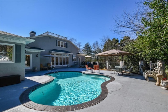 view of pool featuring a patio