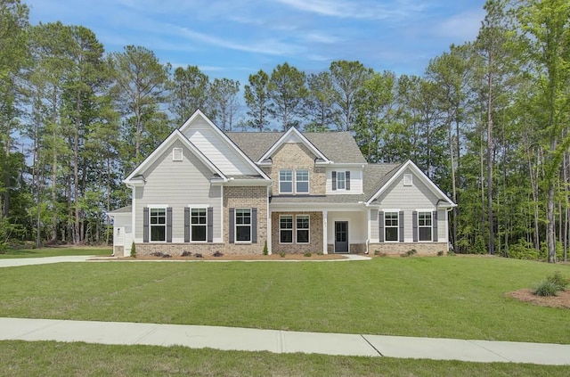 craftsman-style home with a front yard