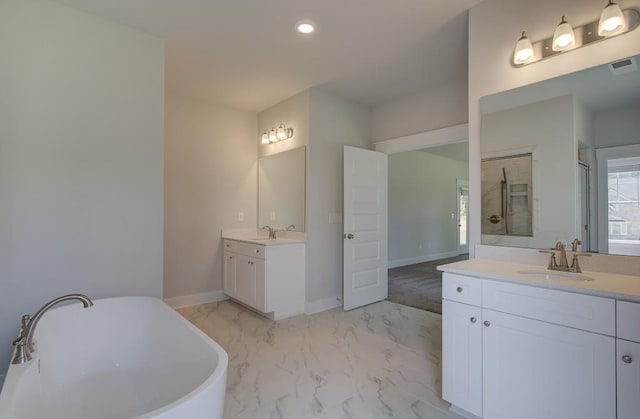 bathroom with vanity and independent shower and bath