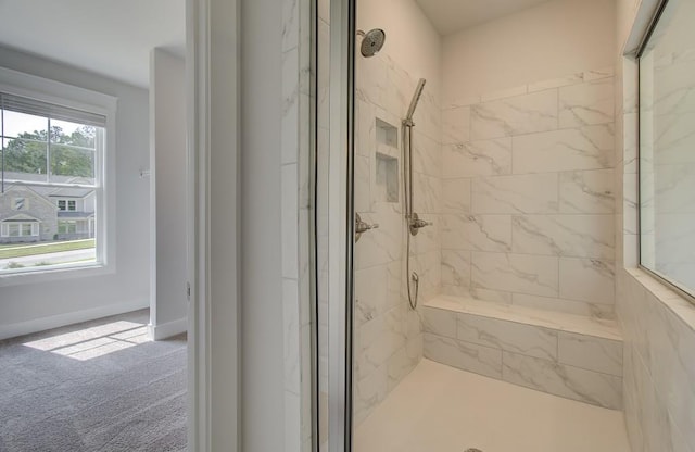 bathroom with tiled shower