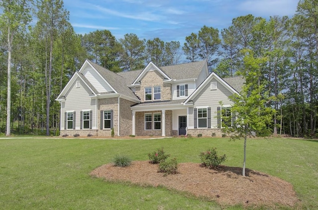 craftsman-style home featuring a front lawn