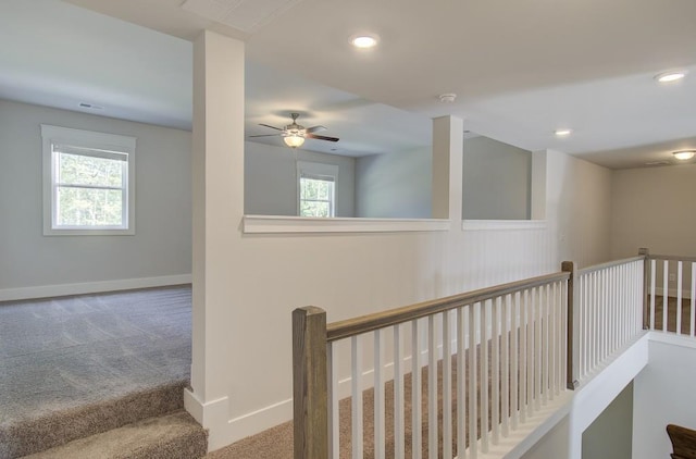 hallway featuring carpet flooring