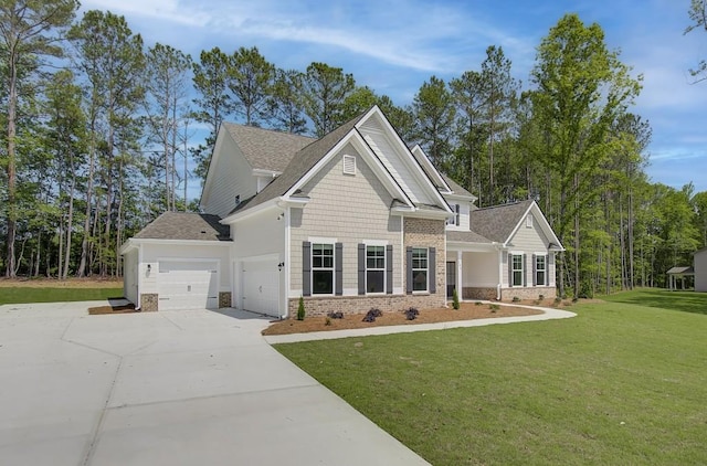 craftsman-style house featuring a front yard and a garage