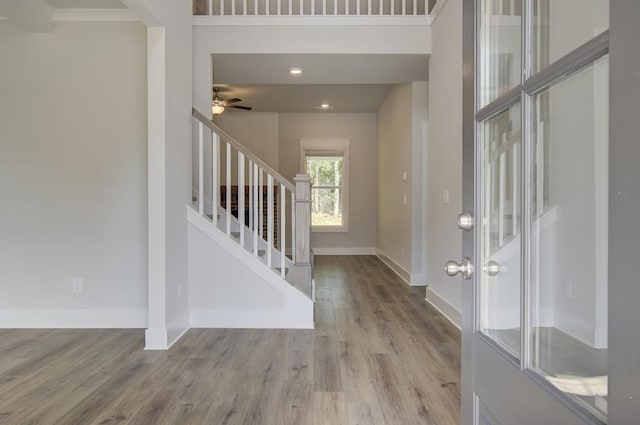 entrance foyer with light wood-type flooring and ceiling fan