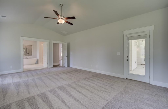 interior space featuring light colored carpet, ceiling fan, and lofted ceiling