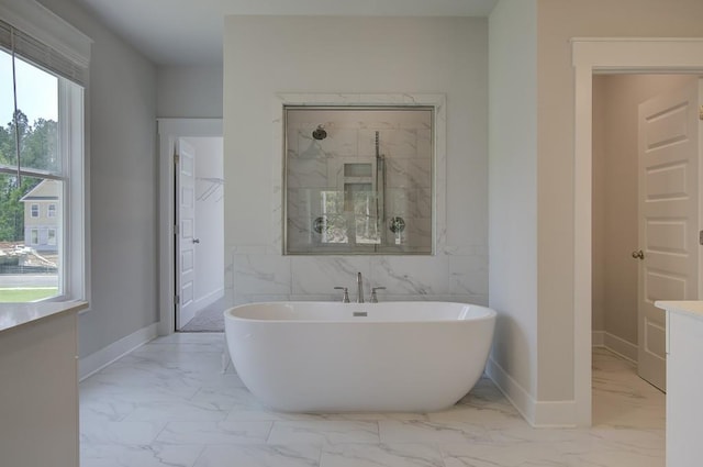 bathroom with shower with separate bathtub, vanity, and tile walls