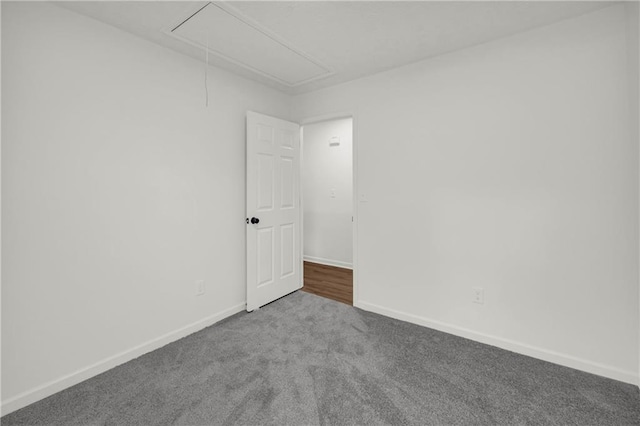 1645 Cobbs Creek Ln, Decatur, GA 30032 - carpeted empty room with attic access and baseboards