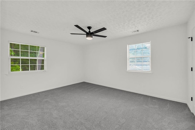 1645 Cobbs Creek Ln, Decatur, GA 30032 - spare room with carpet, ceiling fan, a textured ceiling, and baseboards