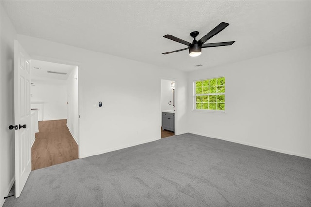 1645 Cobbs Creek Ln, Decatur, GA 30032 - unfurnished bedroom featuring carpet, baseboards, ceiling fan, and connected bathroom