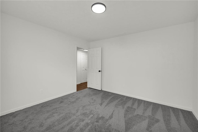 1645 Cobbs Creek Ln, Decatur, GA 30032 - spare room with dark colored carpet and baseboards