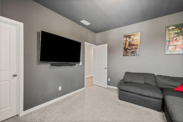 living area with visible vents and baseboards