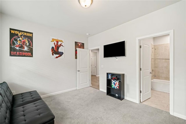 living area with carpet and baseboards