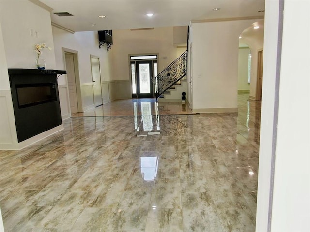 4590 River Stone Trl, Douglasville, GA 30135 - foyer with arched walkways, stairway, and recessed lighting