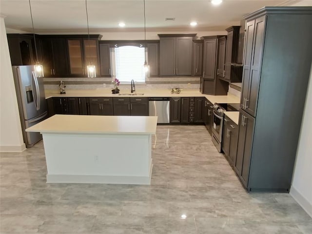 4590 River Stone Trl, Douglasville, GA 30135 - kitchen with appliances with stainless steel finishes, a sink, light countertops, a kitchen island, and hanging light fixtures
