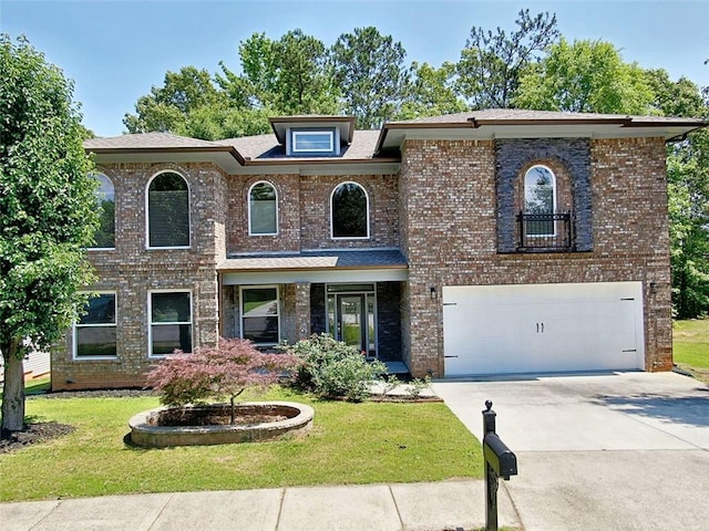 4590 River Stone Trl, Douglasville, GA 30135 - view of front of property with a garage, driveway, a front lawn, and brick siding
