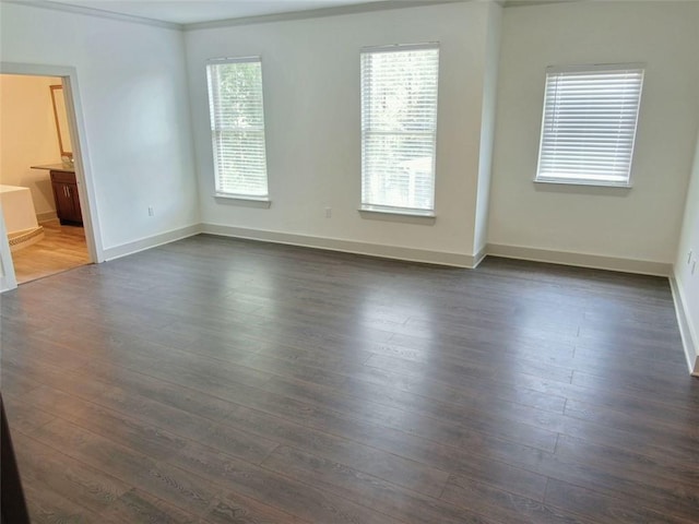 4590 River Stone Trl, Douglasville, GA 30135 - empty room with dark wood-type flooring, baseboards, and ornamental molding