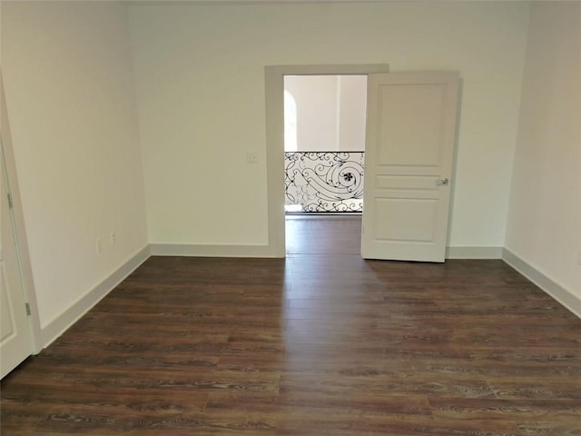 4590 River Stone Trl, Douglasville, GA 30135 - spare room featuring dark wood-type flooring and baseboards