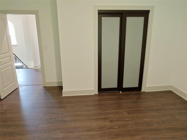 4590 River Stone Trl, Douglasville, GA 30135 - empty room featuring baseboards and dark wood-style floors