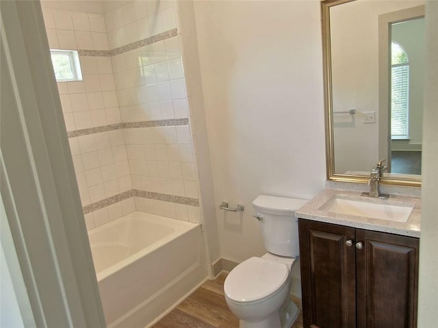 4590 River Stone Trl, Douglasville, GA 30135 - full bathroom featuring toilet, vanity, wood finished floors, baseboards, and shower / washtub combination