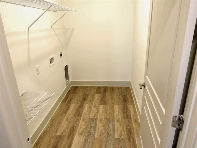 4590 River Stone Trl, Douglasville, GA 30135 - laundry room with wood finished floors, hookup for a washing machine, baseboards, and hookup for an electric dryer