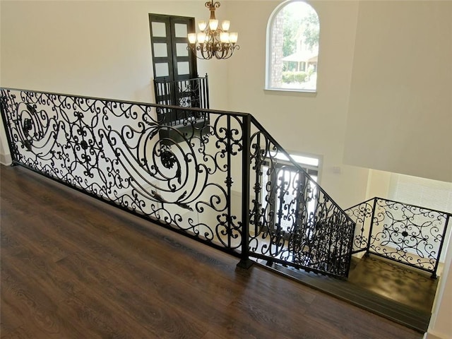 4590 River Stone Trl, Douglasville, GA 30135 - staircase with a chandelier and wood finished floors