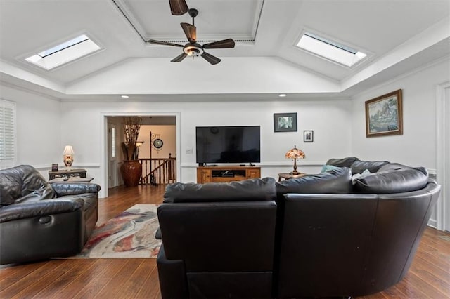 263 Mountainview Cir, Canton, GA 30115 - living room featuring a skylight, vaulted ceiling, a tray ceiling, dark wood-style floors, and a ceiling fan