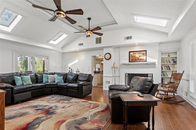 263 Mountainview Cir, Canton, GA 30115 - living room featuring vaulted ceiling, a skylight, a ceiling fan, wood-type flooring, and a fireplace