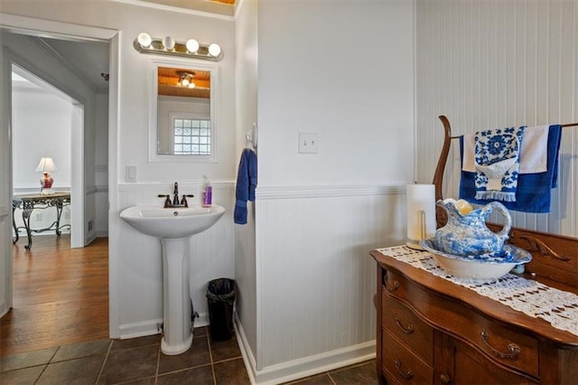 263 Mountainview Cir, Canton, GA 30115 - bathroom featuring crown molding, a wainscoted wall, and tile patterned flooring