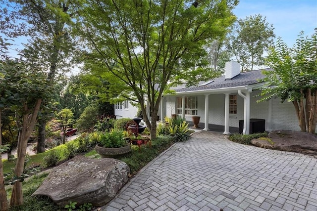 263 Mountainview Cir, Canton, GA 30115 - view of front facade featuring a porch, a chimney, and brick siding