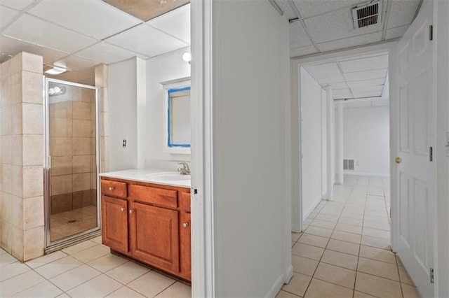 263 Mountainview Cir, Canton, GA 30115 - full bathroom featuring a drop ceiling, tile patterned flooring, a shower stall, and vanity
