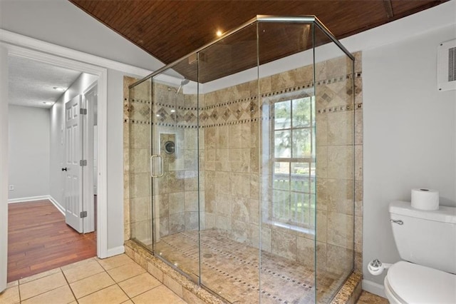 263 Mountainview Cir, Canton, GA 30115 - full bathroom featuring tile patterned flooring, a shower stall, and lofted ceiling