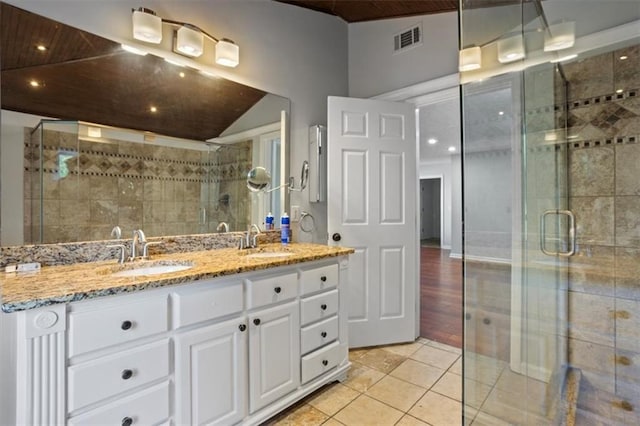 263 Mountainview Cir, Canton, GA 30115 - full bathroom with double vanity, a shower stall, tile patterned flooring, and recessed lighting