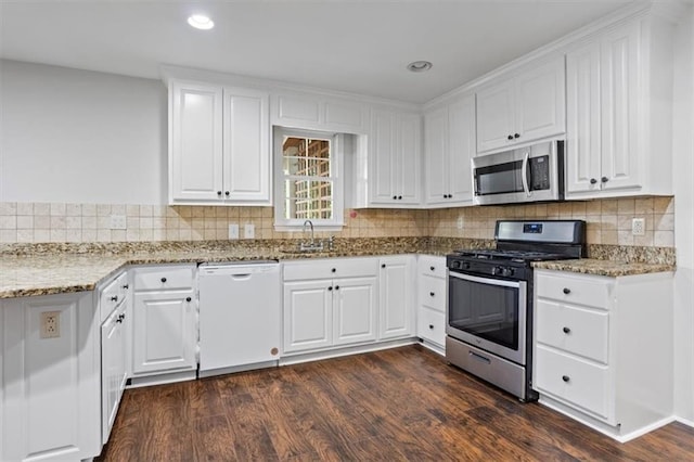 263 Mountainview Cir, Canton, GA 30115 - kitchen with stainless steel appliances, white cabinets, light stone counters, dark wood finished floors, and recessed lighting