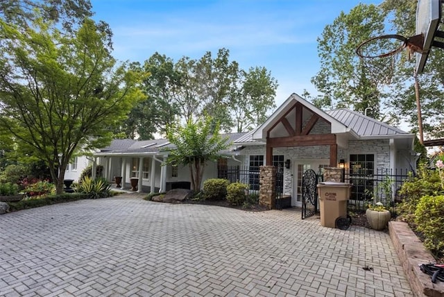 263 Mountainview Cir, Canton, GA 30115 - ranch-style house with stone siding, a fenced front yard, a gate, a standing seam roof, and a metal roof