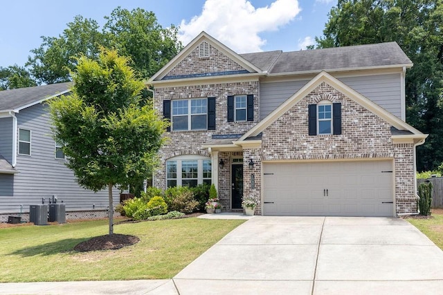 2099 Lakeview Bend Way, Buford, GA 30519 - traditional home with concrete driveway, a front yard, and brick siding
