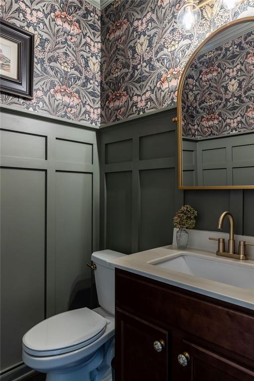 2099 Lakeview Bend Way, Buford, GA 30519 - bathroom with wallpapered walls, vanity, and a decorative wall