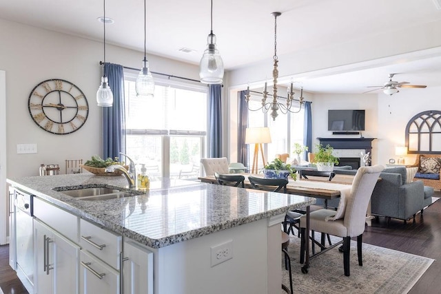 2099 Lakeview Bend Way, Buford, GA 30519 - kitchen with healthy amount of natural light, dark wood-type flooring, an island with sink, and ceiling fan
