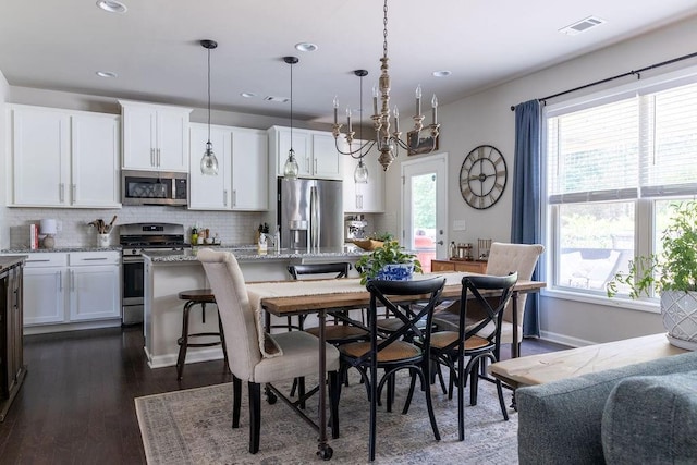 2099 Lakeview Bend Way, Buford, GA 30519 - dining area with healthy amount of natural light, dark wood finished floors, and recessed lighting