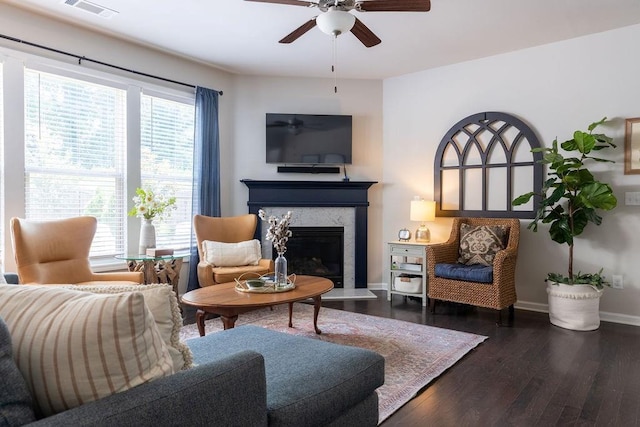 2099 Lakeview Bend Way, Buford, GA 30519 - living area featuring a high end fireplace, ceiling fan, and dark wood-type flooring