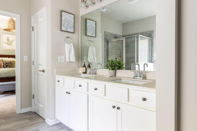 2099 Lakeview Bend Way, Buford, GA 30519 - full bathroom with connected bathroom, a shower stall, double vanity, and wood finished floors